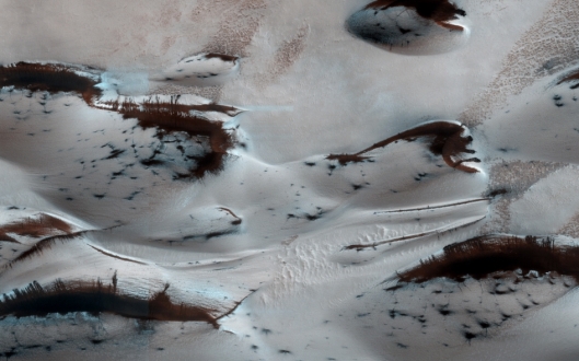 As the spring season begins, the red planet's dunes can be seen emerging from winter's cover. It's not snow; it's dry ice! This image was taken by NASA's Mars Reconnaissance Obiter in January.  Image Credit: NASA/JPL-Caltech/Univ. of Arizona